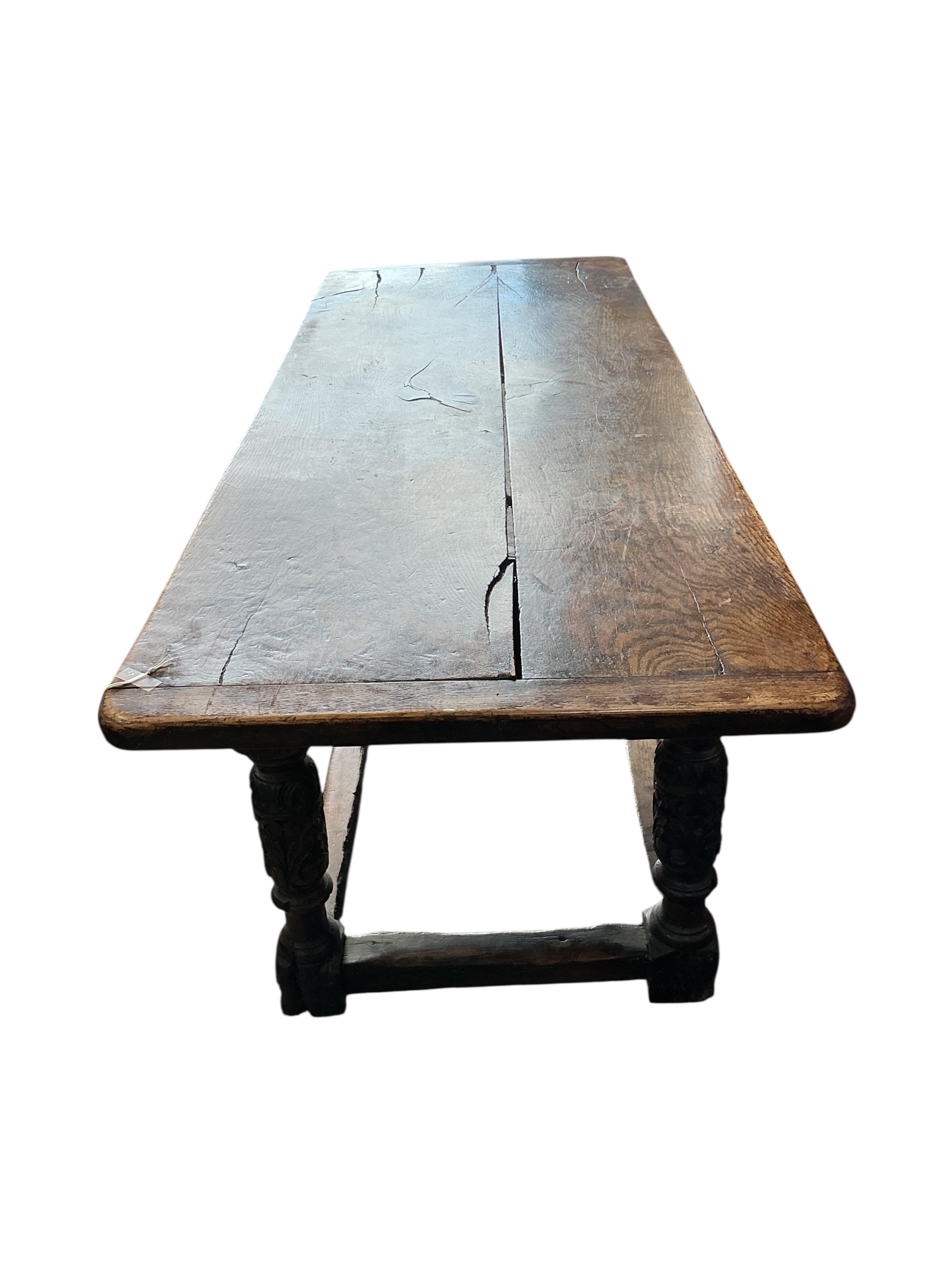 A 17th century style carved oak rectangular refectory table, incorporates old timber, width 198cm, depth 75cm, height 76cm